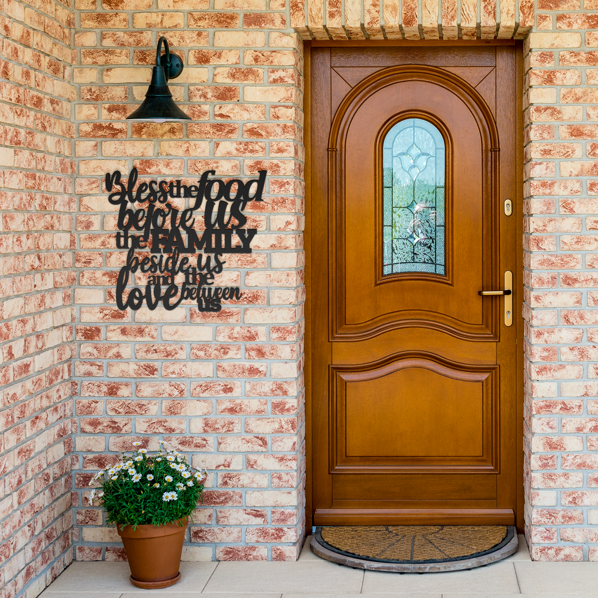 Christian_Metal_Wall_Art_Bless_The_Food_Black_Brick_Entrance_Mockup.png