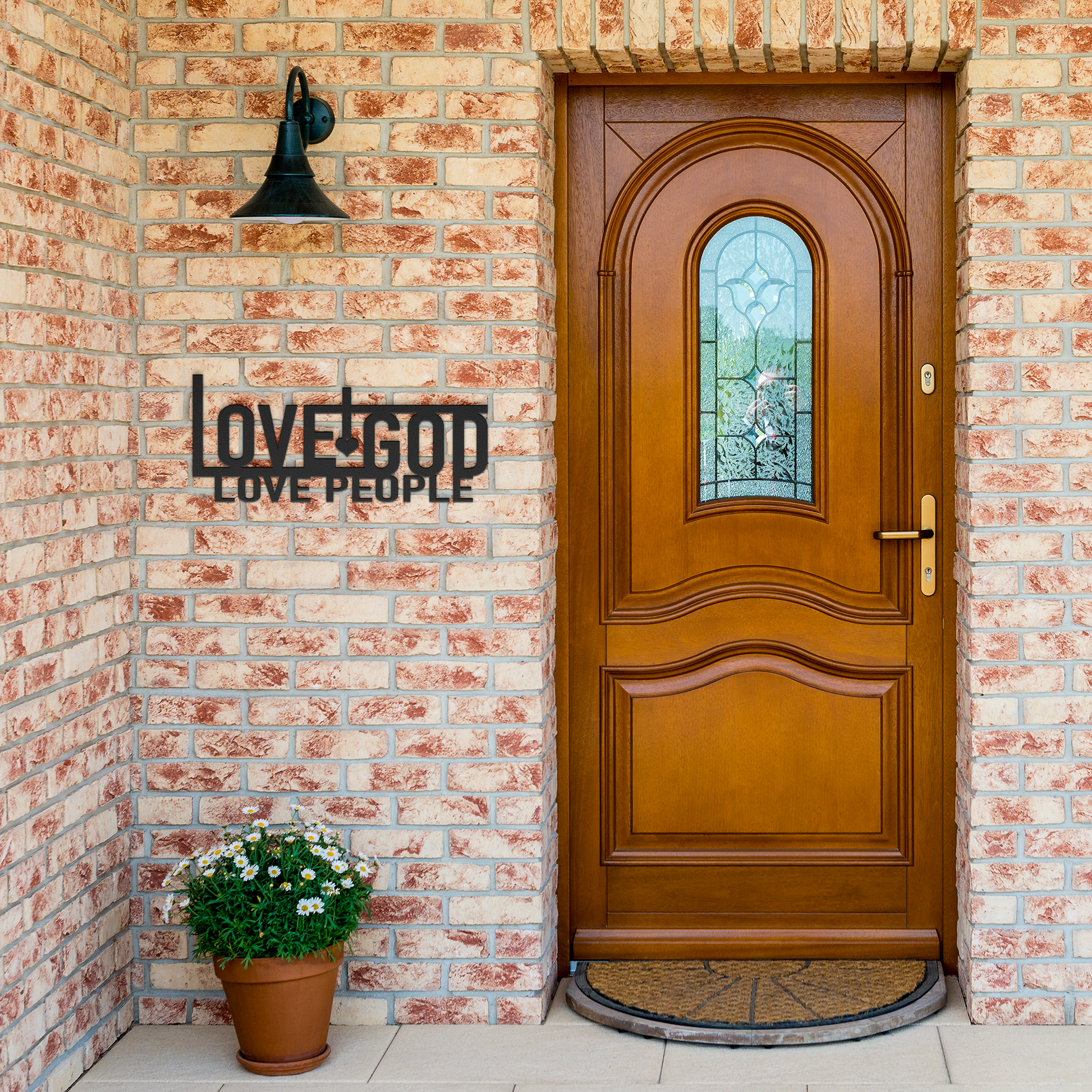 Love_God_Love_People_Metal_Wall_Art_Sign_Black_Brick_Entrance_Mockup.png